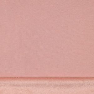 Detailaufnahme des Alpenfleece Stoffs in Aprikose mit umgeklappter, flauschiger Kurzhaarflor-R&uuml;ckseite.