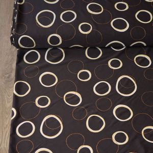 Badelycra Stoff in Dunkelbraun mit Kreis-Muster: Geometrisches Design mit hellem Strukturdruck und kupferfarbenen Glitzerringen für Kür und Tanz.