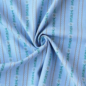 Nahaufnahme des gewobenen Edelweiss Baumwollstoffes in hellblau, mit sichtbarer Garnstruktur und dem feinen Edelweiss-Muster in Streifen.