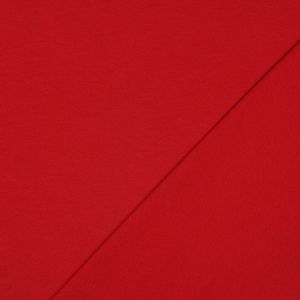 Himbeerroter GOTS Sommersweat: rechts glatte Oberfläche, links die typische ungefasste French Terry Schlingenstruktur, nicht angeraut. 