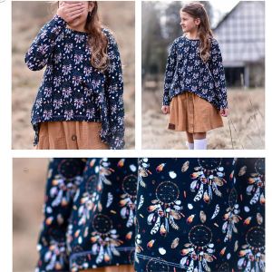 Ein Mädchen trägt ein selbstgenähtes Langarm-Shirt aus dem dunkelblauen French Terry Stoff Traumfänger von Fräulein von Julie.