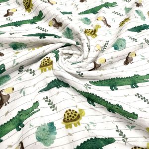Musselin Double Gauze Stoff mit Zoo-Tieren: Krokodil, Schildkröte und Tukan auf weissem Grund. Ideal für Nuscheli und leichte Kinder-Sommerkleidung.